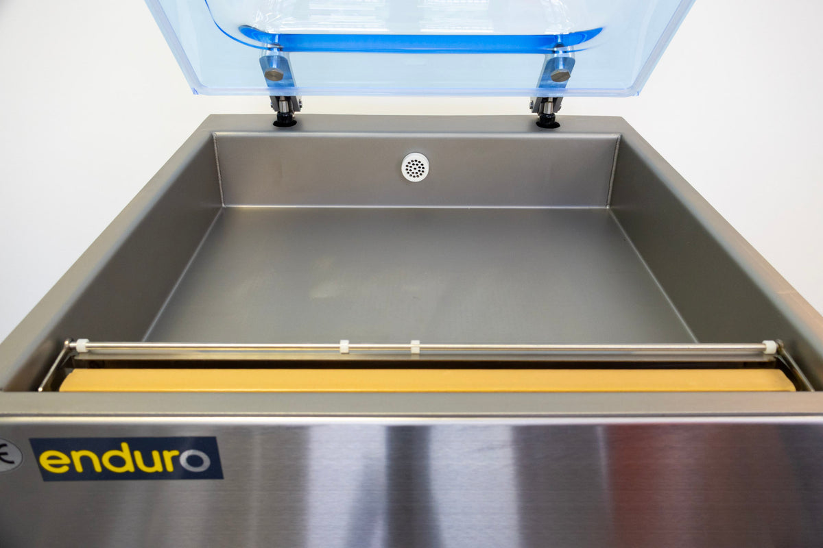 Stainless steel machine with a clear lid on a white background, featuring the 'enduro' brand.