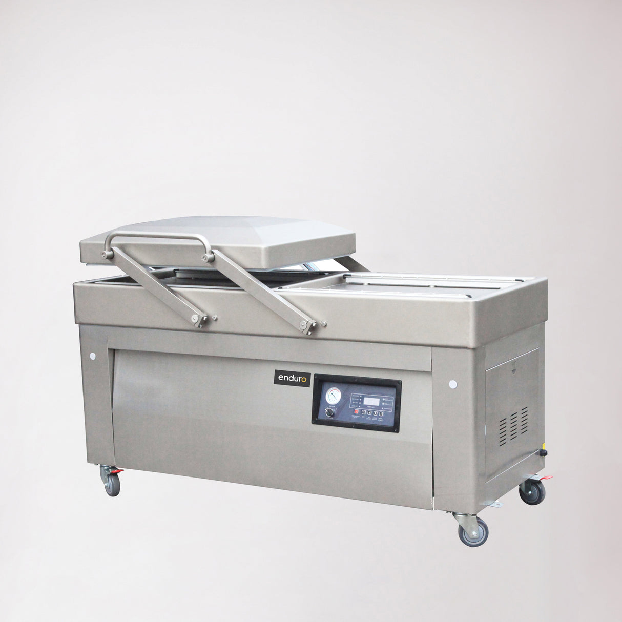 A floor-standing, double chamber gas-flush vacuum packaging machine with a digital display, control panel, and set on mobility castors.
