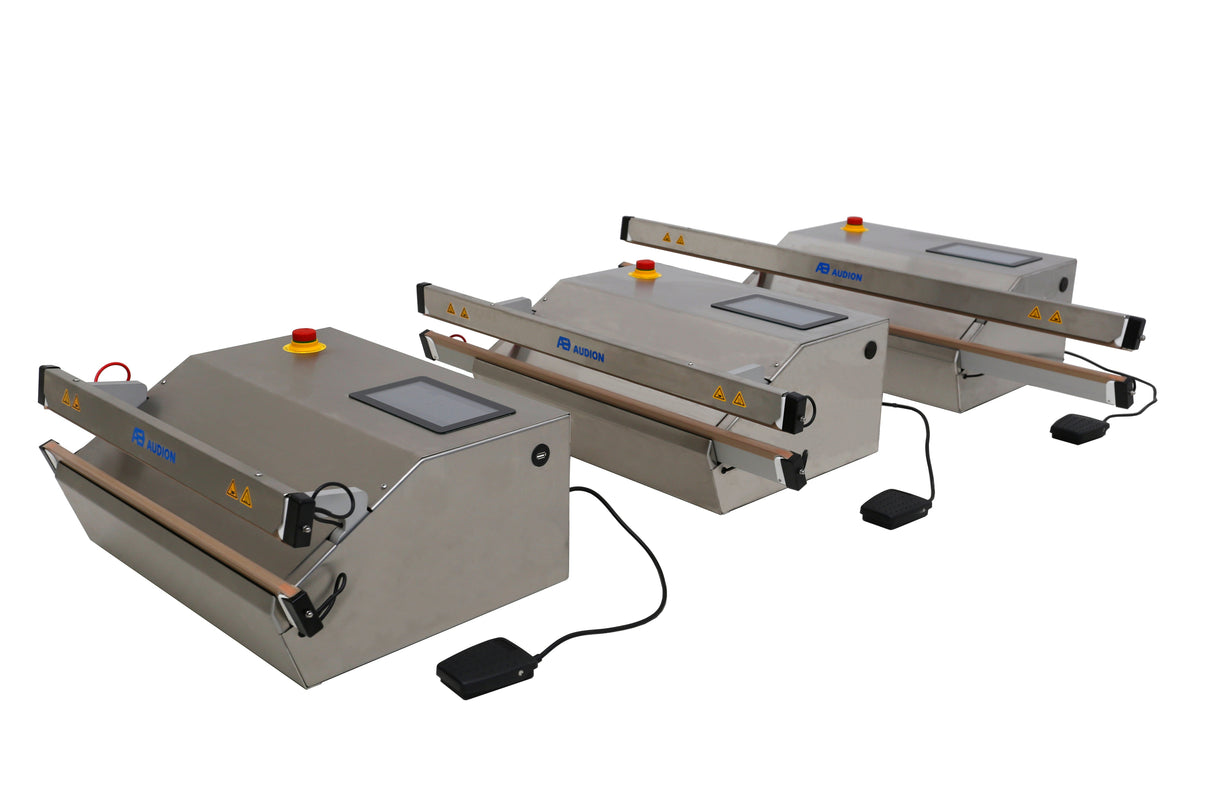 Three industrial sealing machines on a white background