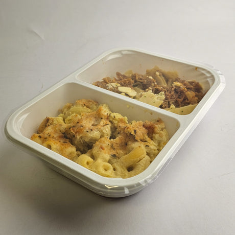 Two compartments of food in a white container on a light gray background