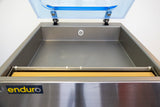 Stainless steel machine with a clear lid on a white background, featuring the 'enduro' brand.