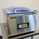 Stainless steel vacuum chamber with 'enduro' branding on a white background