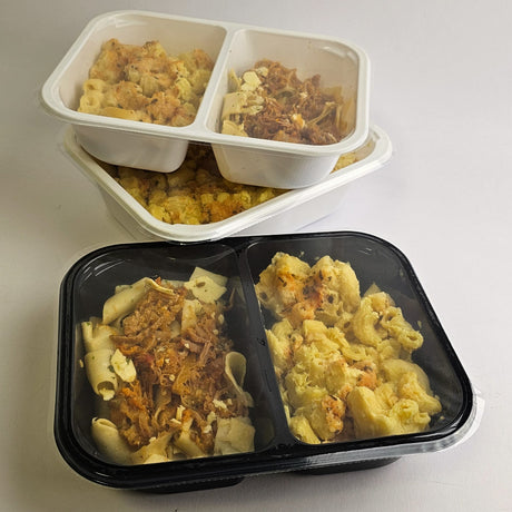 Three containers of pasta with different toppings on a white surface